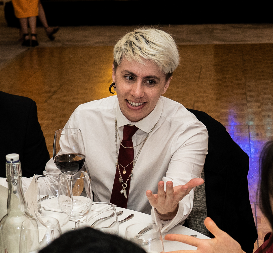 Photograph of Caspian talking at a table